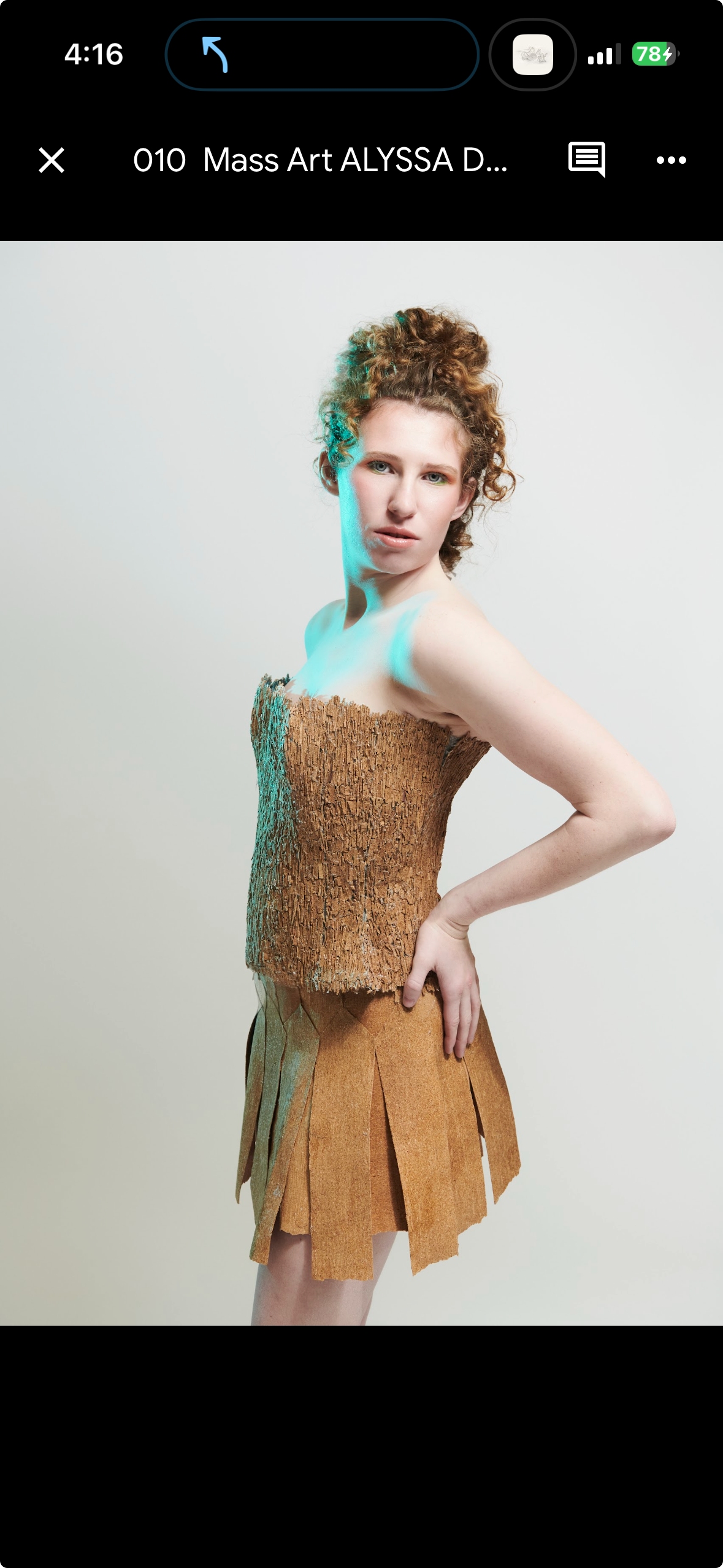Tan knit top and suede skirt, editorial